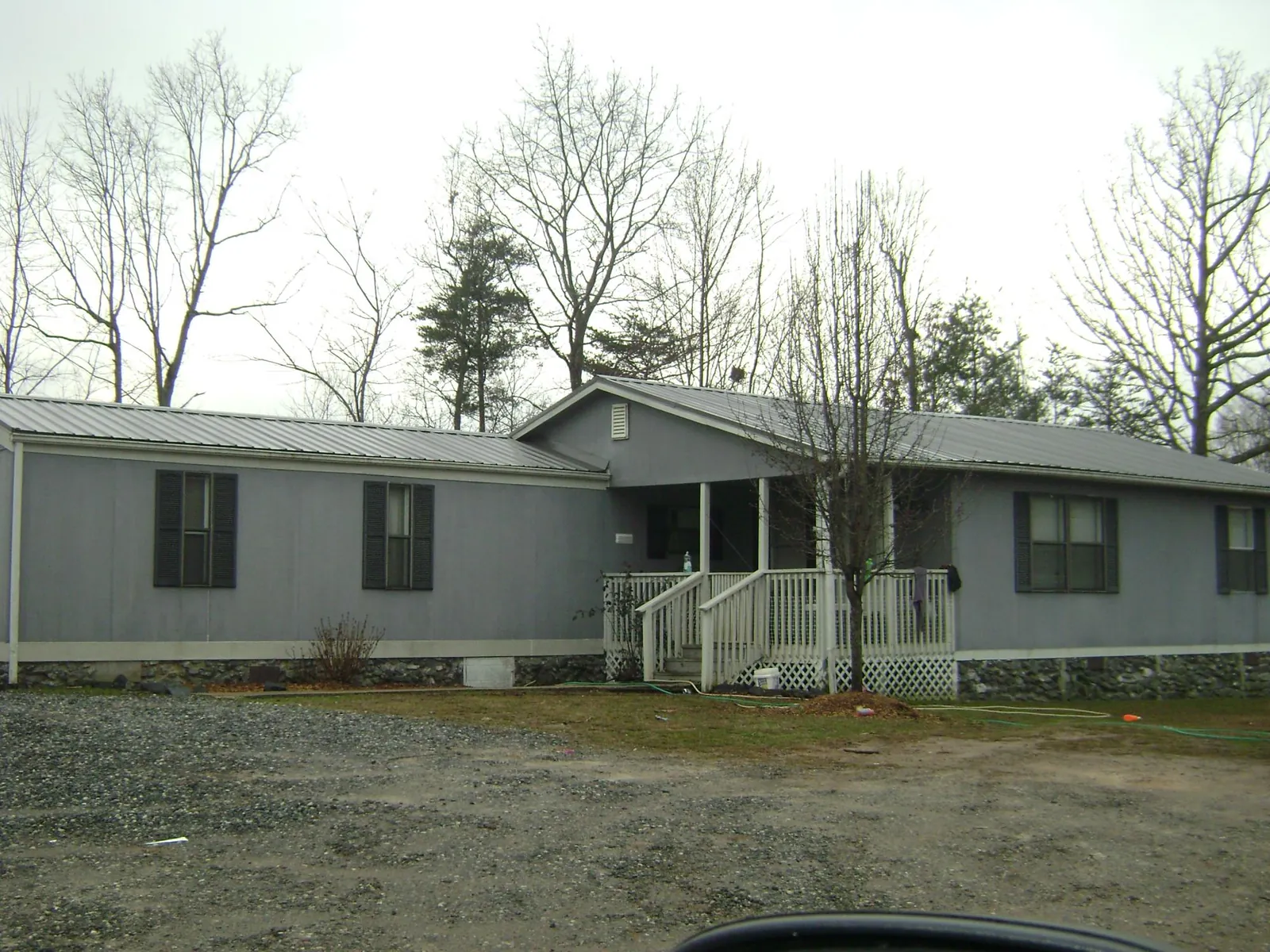 Metal roof over a manufactured home with a covered front porch in Camano Island